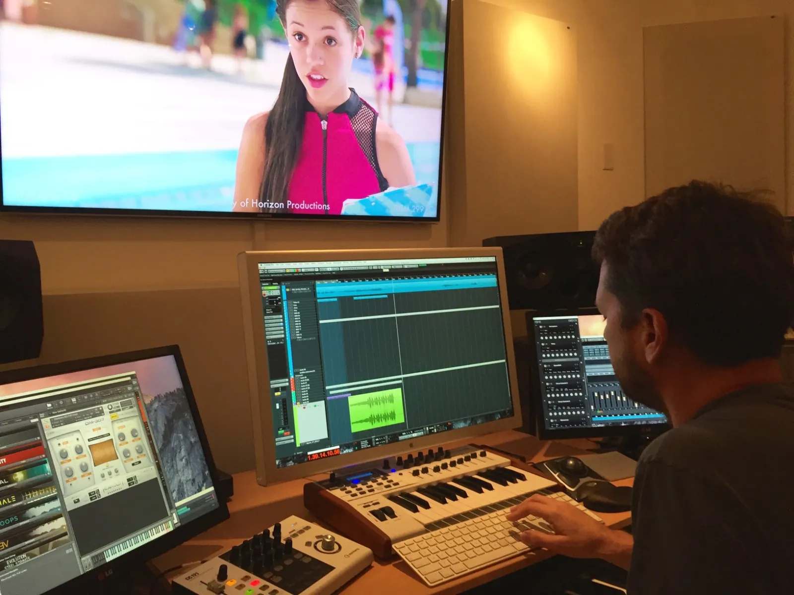 Kenneth Burgomaster scoring for Disney in his studio.