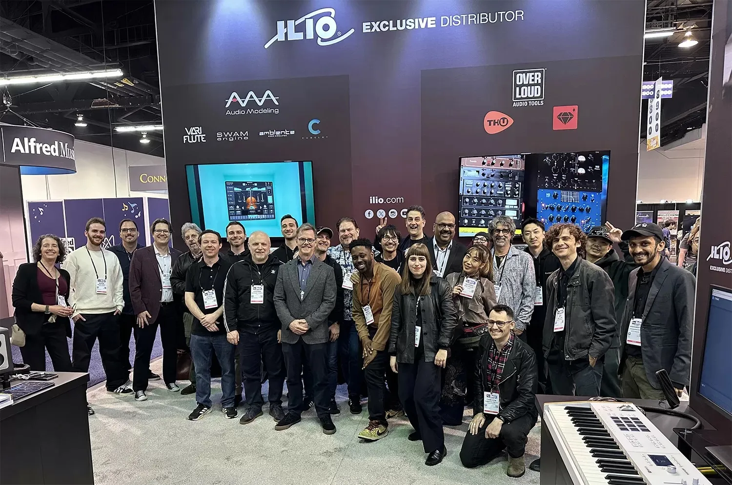 ILIO team with developer partners at NAMM showcasing professional virtual instrument brands and music production tools
