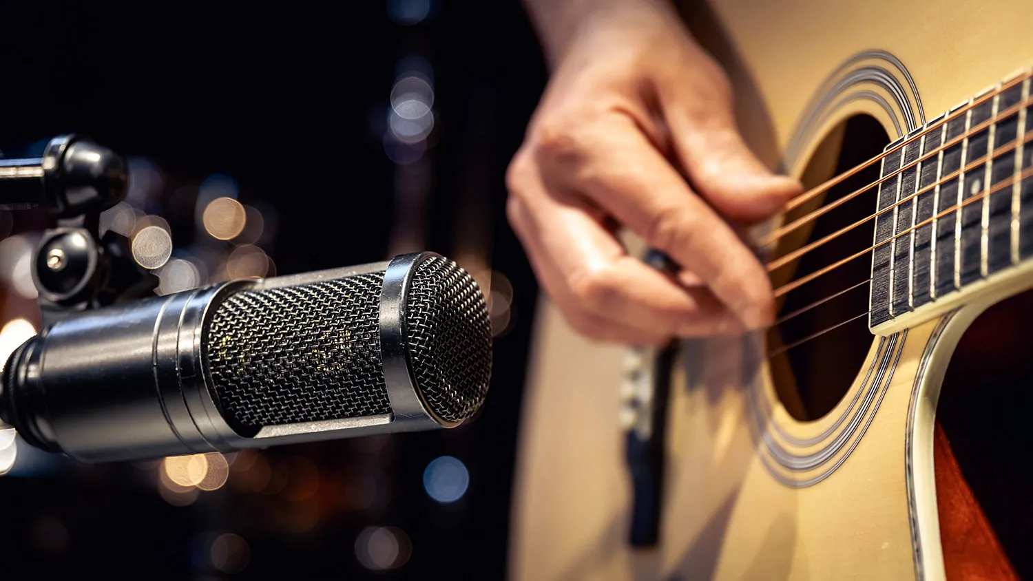 Sampling a guitar using a microphone while a guitar player performs