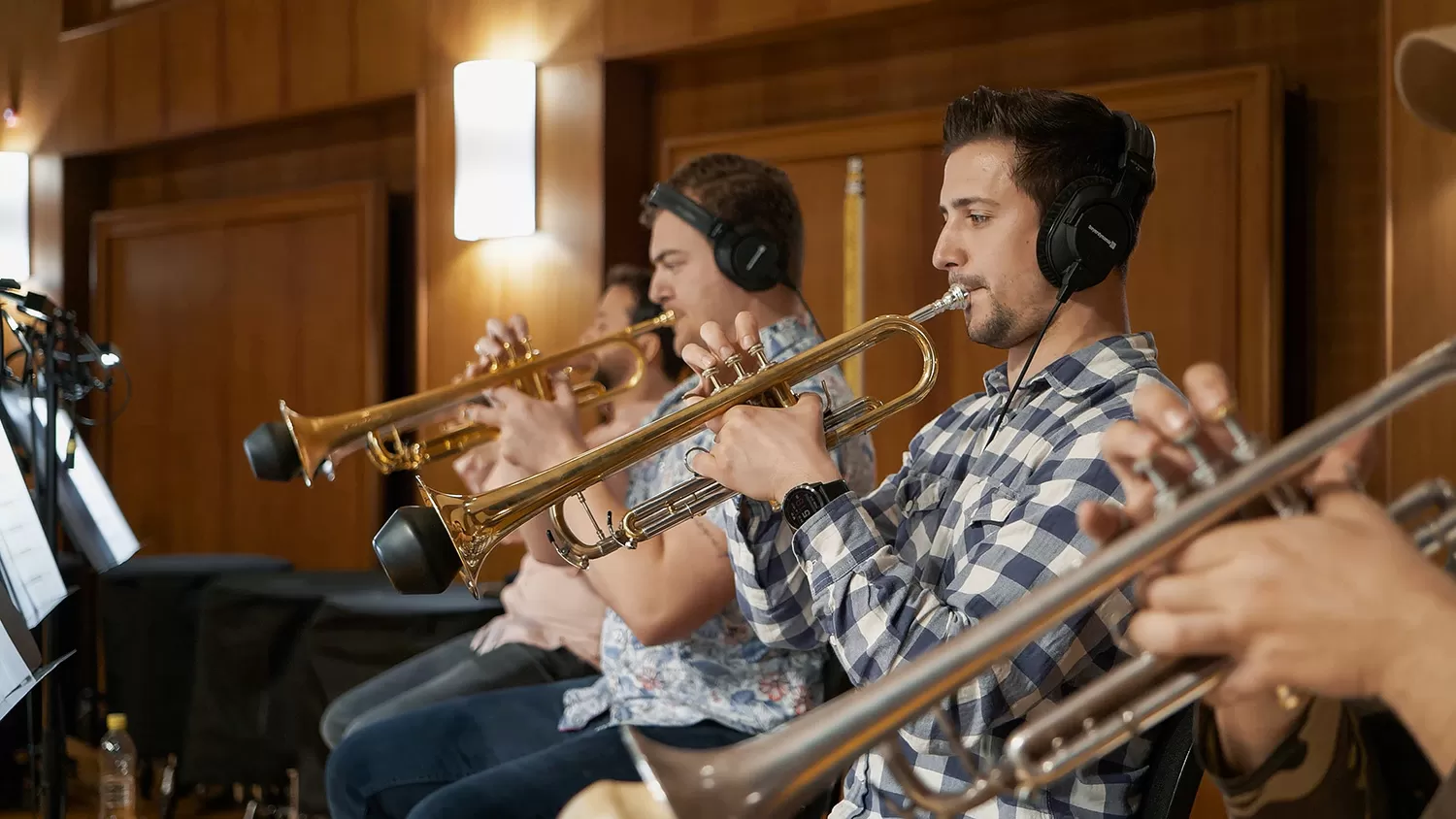 An ensemble of muted trumpets is played during a recording session on the Synchron Stage for Vienna Synchron Special Brass